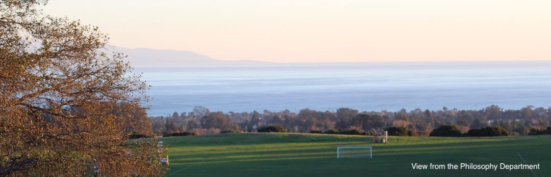 A view of Monterey Bay from Cowell College. Students play volleyball in the foreground. 